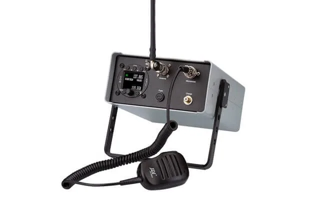 TB3 R mobile radio station in a grey case with its handheld push-to-talk microphone